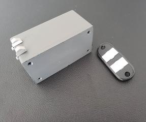 Gray box with small black component