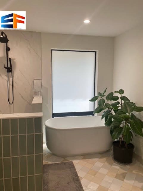 Minimalist bathroom design with plant