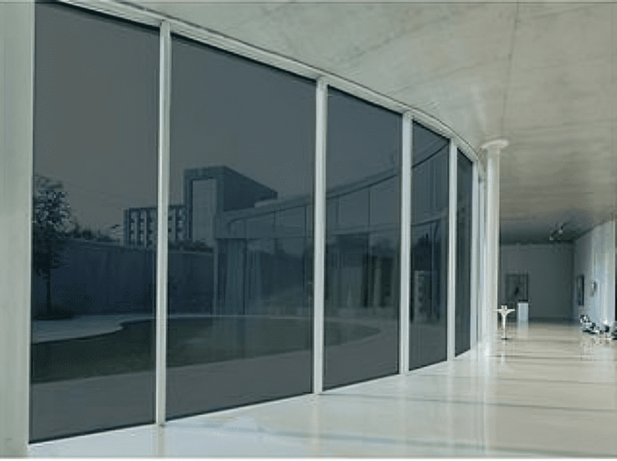 Modern glass building exterior with reflections