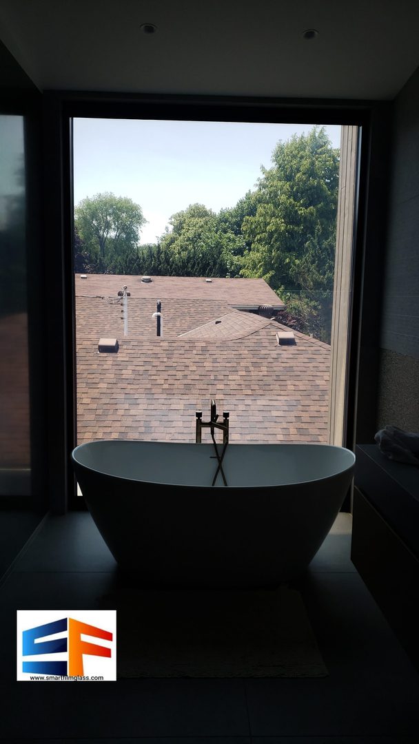 Freestanding bathtub with rooftop view