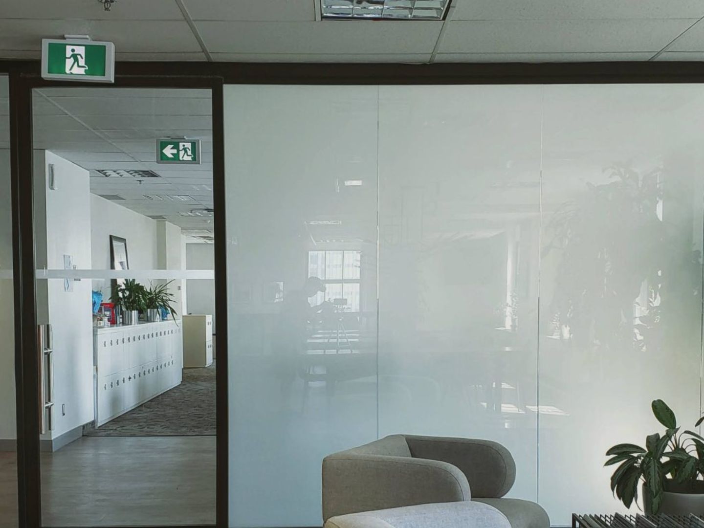 Office lounge with armchair and potted plant