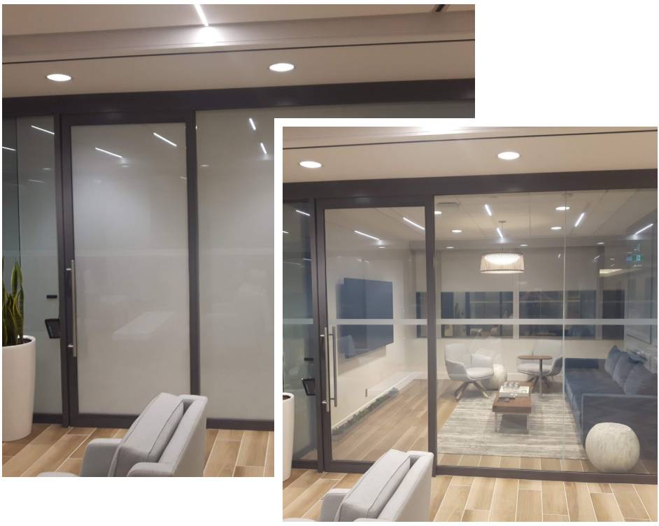 Modern office lounge with glass partition and seating