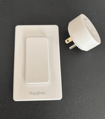 White smart light switch and plug adapter